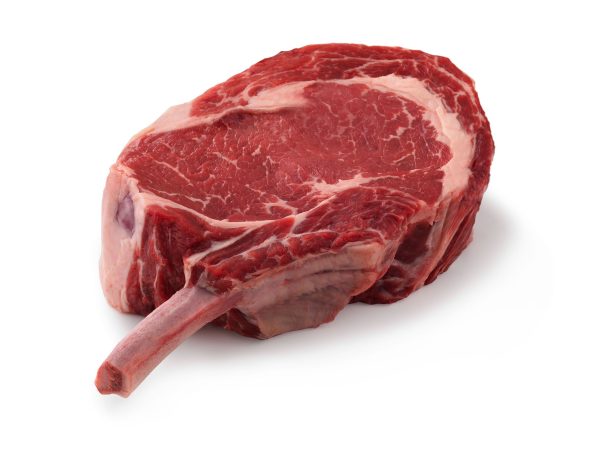 A farm raised Beef Cowboy Steak (1lb) from We Speak Meat Company on a white background.