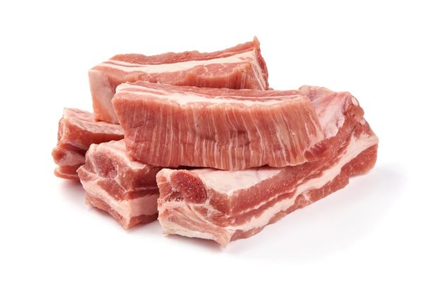 Buy yours now - a pile of Lamb Riblets (1lb) for sale on a white background.