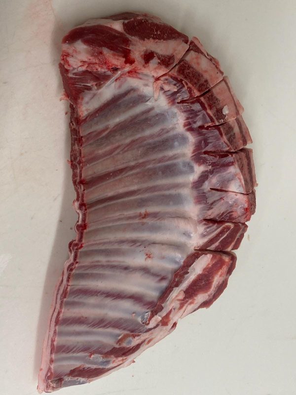 Buy yours now - a piece of Lamb Rib Whole (1lb) on a white surface.