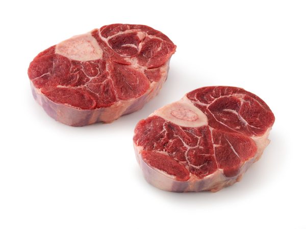 Two pieces of Shank Cross Cut Osso Buco (1lb) on a white background. Buy yours now from We Speak Meat Company.