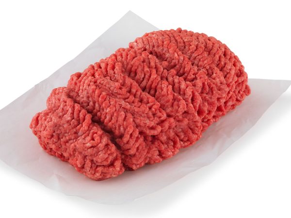 A farm raised order of Ground Beef 80/20 (1lb) from the We Speak Meat Company is sitting on a piece of paper.
