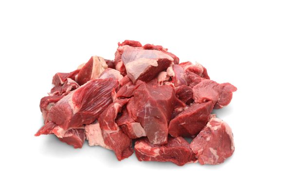 A pile of Special Trim Stew Meat (1lb) from We Speak Meat Company on a white background.