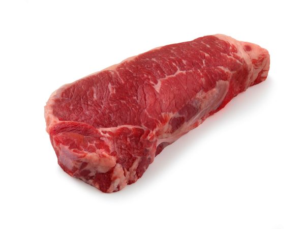 A raw striploin steak isolated on a white background.